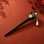 Heritage handcrafted black sandalwood hair stick with celadon porcelain flowers and pearl tassel