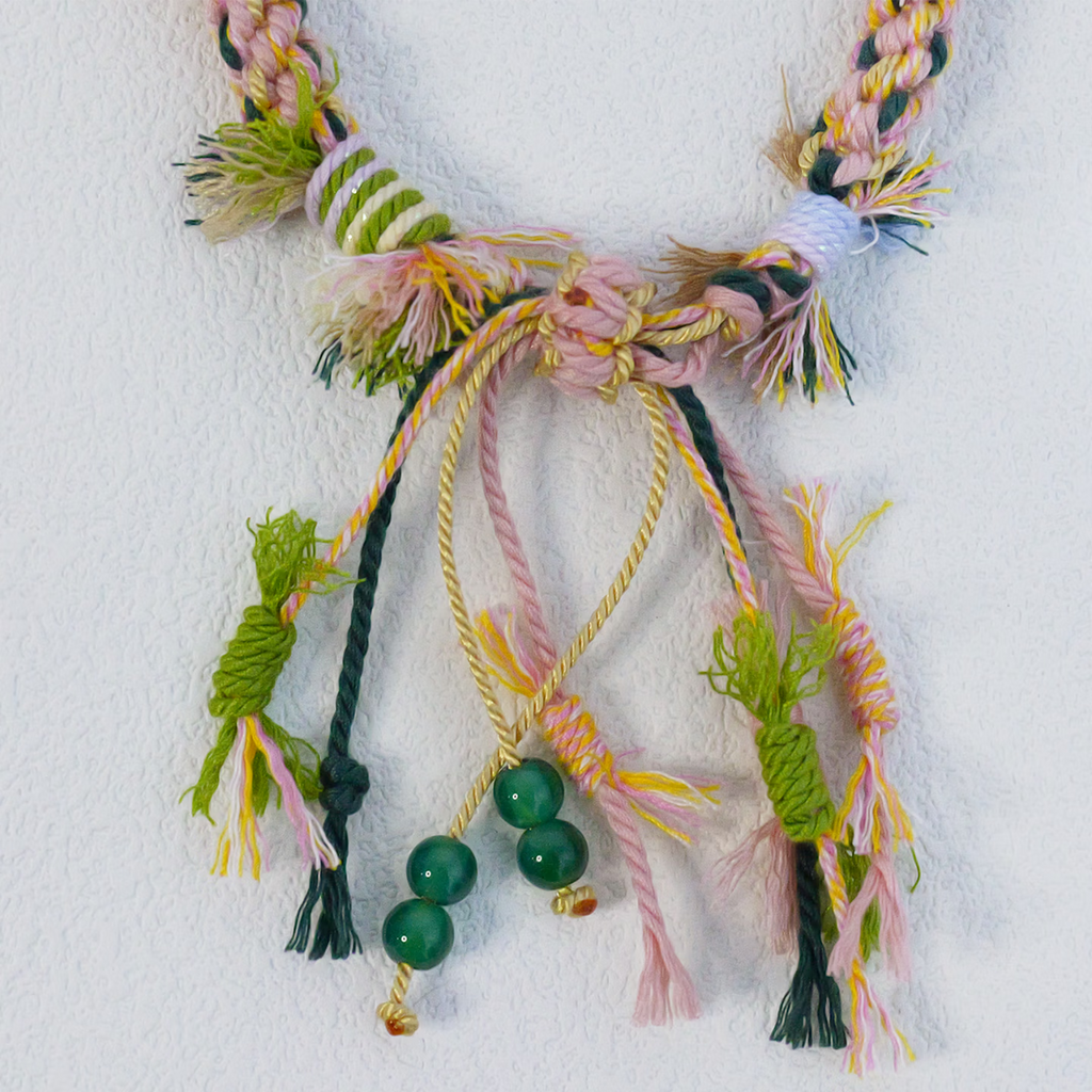 Close up of hand-woven multi-color ethnic knot friendship bracelet