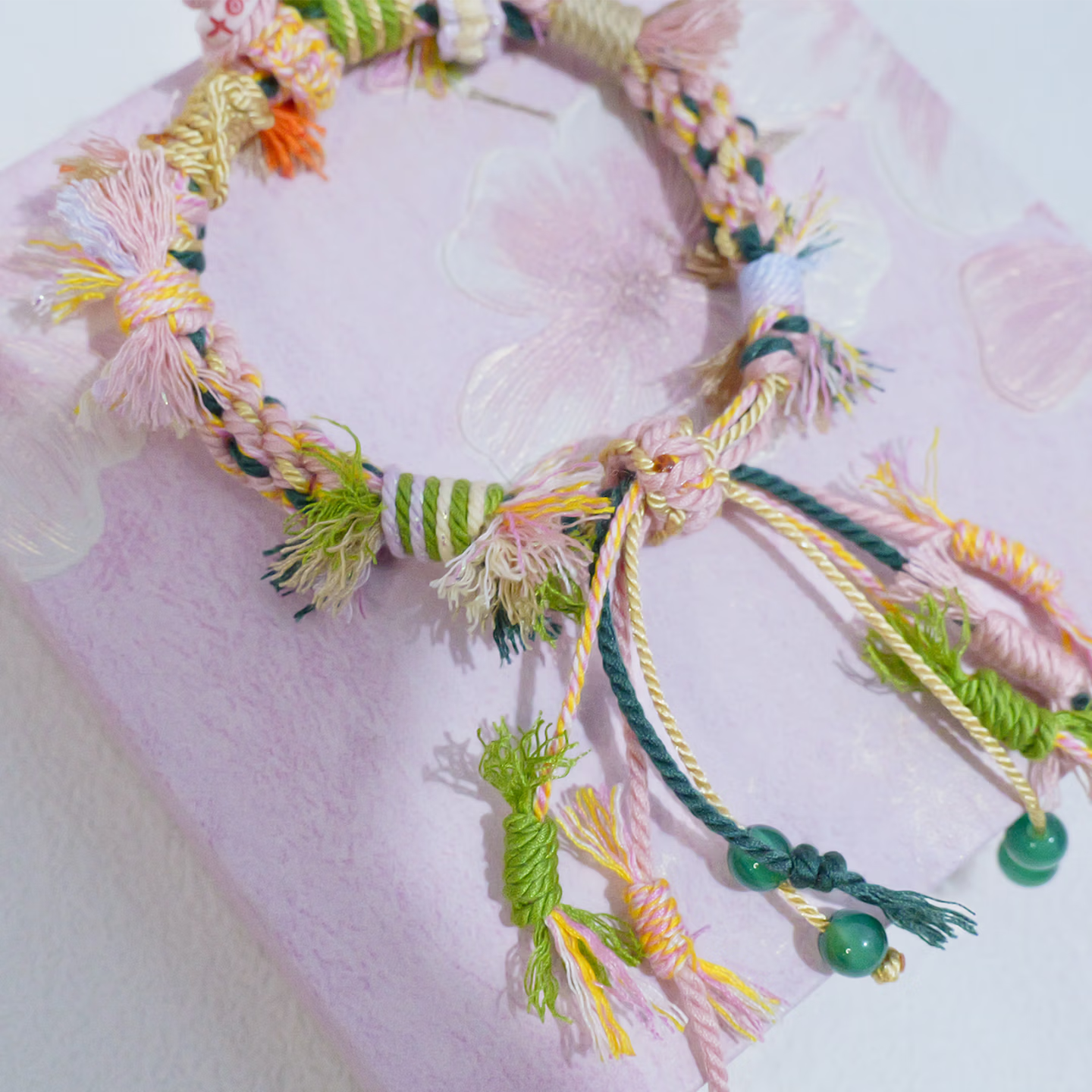 Close up of hand-woven multi-color ethnic knot friendship bracelet