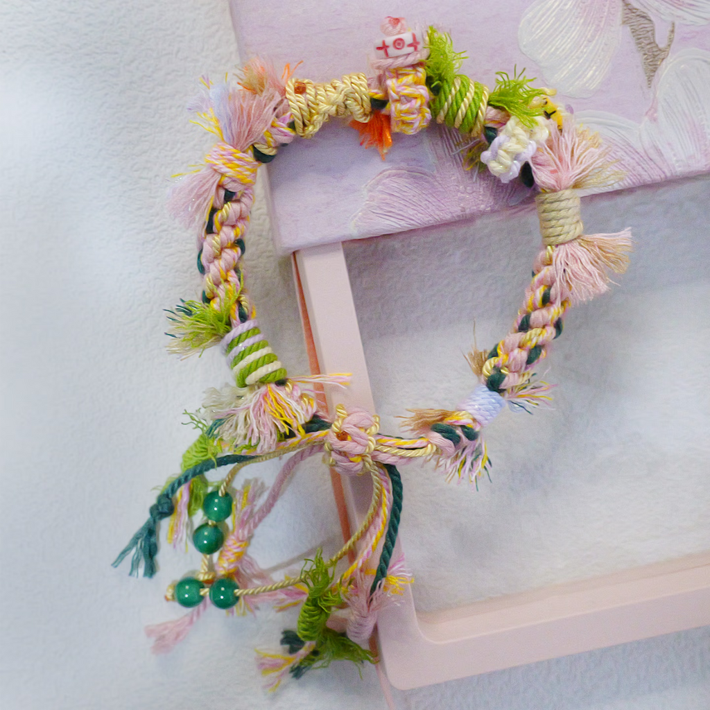 Close up of hand-woven multi-color ethnic knot friendship bracelet