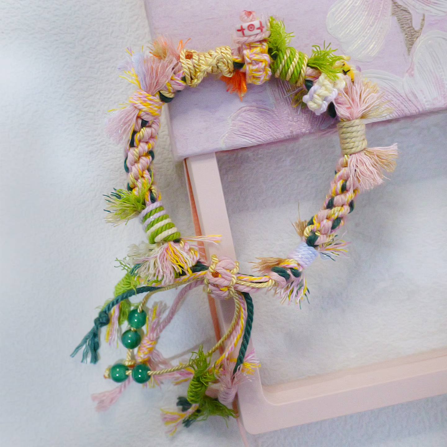 Close up of hand-woven multi-color ethnic knot friendship bracelet