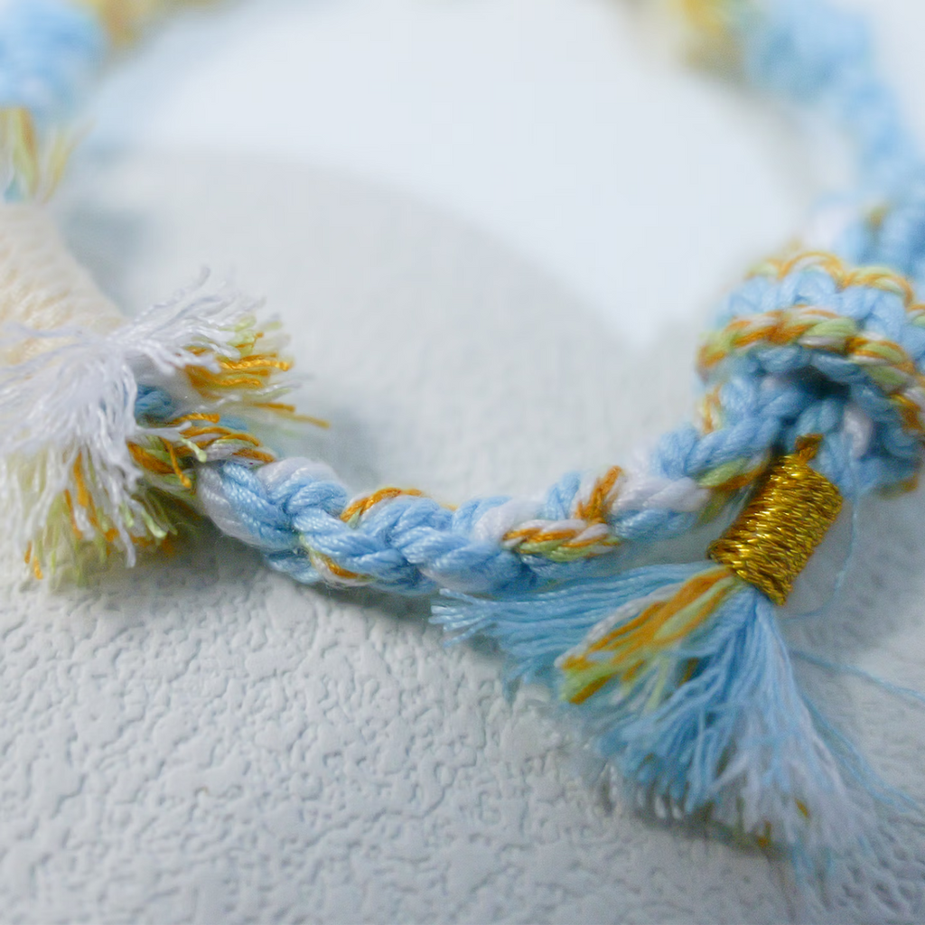 Floral inspiration graphic showing blue hydrangeas and handmade sky blue woven bracelet
