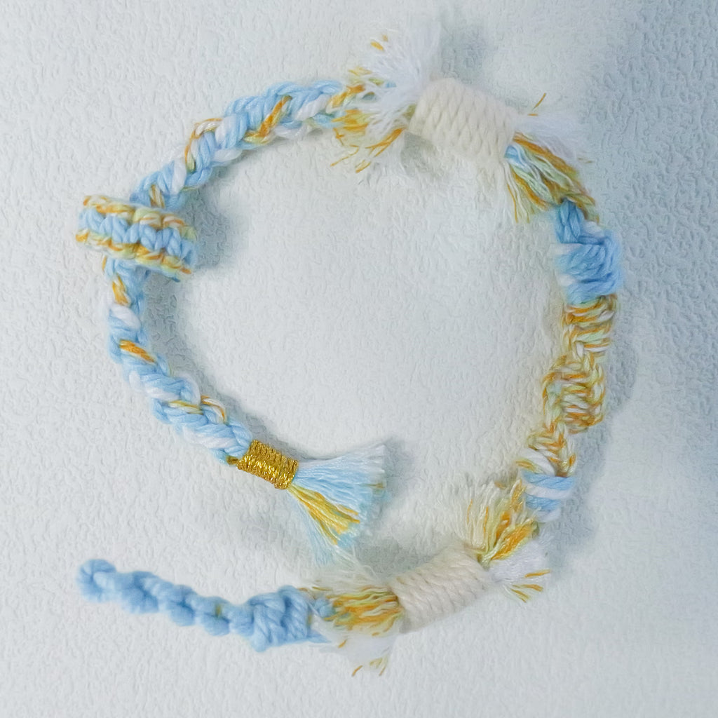 Floral inspiration graphic showing blue hydrangeas and handmade sky blue woven bracelet