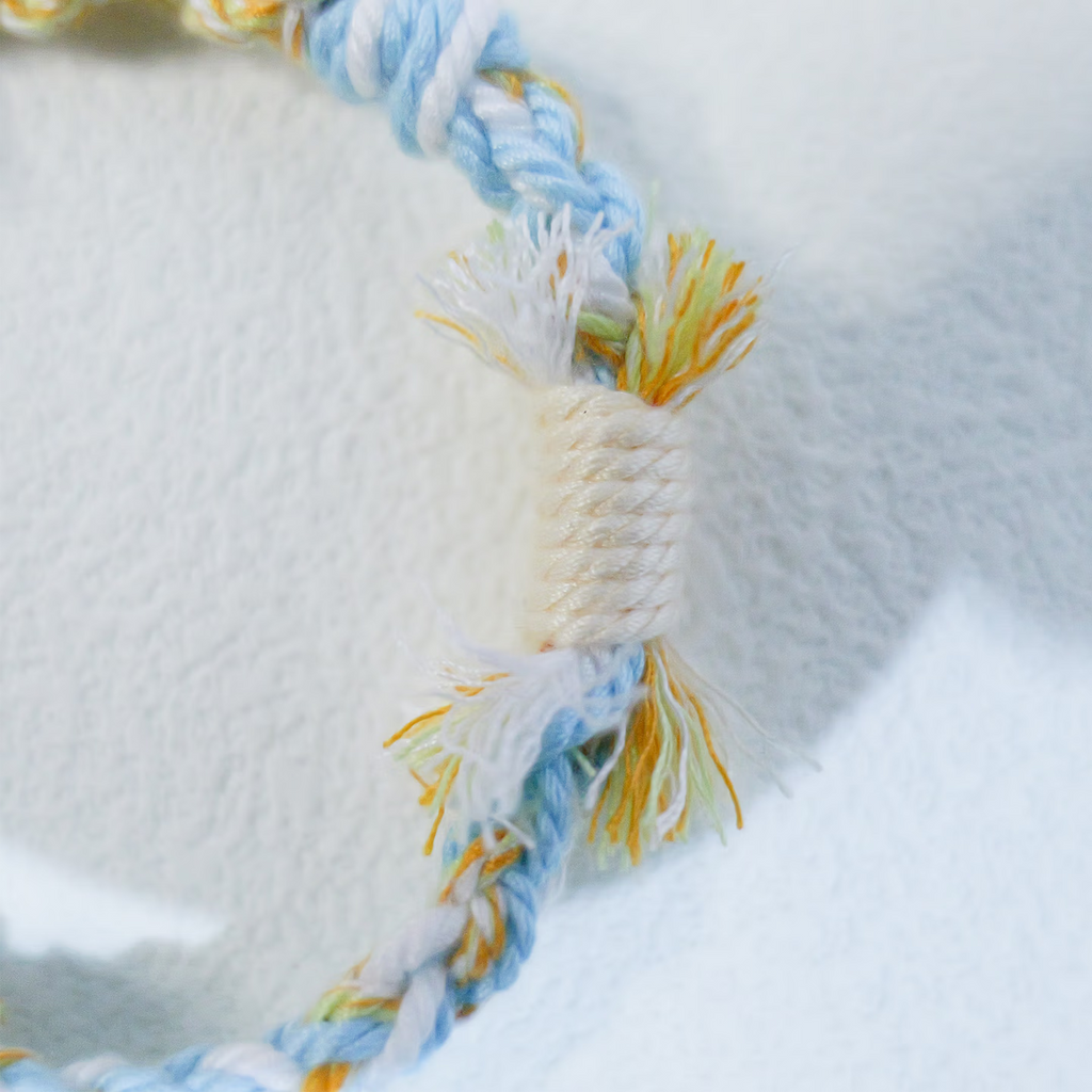 Floral inspiration graphic showing blue hydrangeas and handmade sky blue woven bracelet
