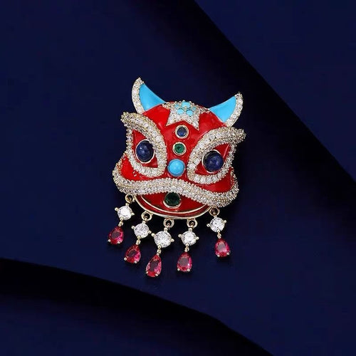 Exquisite electroplated gold awakening lion brooch pin with red enamel pavé rhinestones and dangling tassels