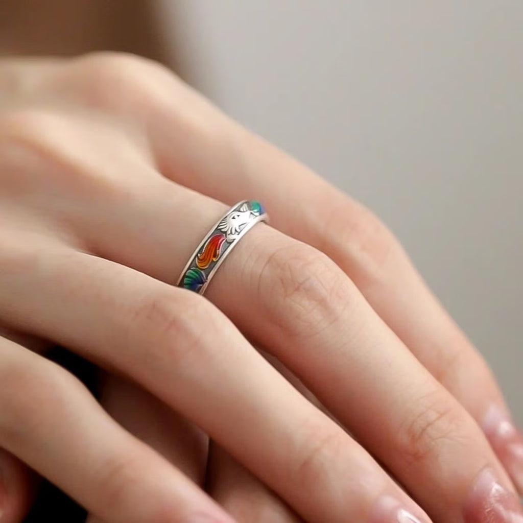 Close up of surface applied multicolor enamel fox tail details on vintage sterling silver ring band