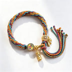 Handmade Tibetan 5-color braided cord bracelet with golden prayer wheel charm and leaves