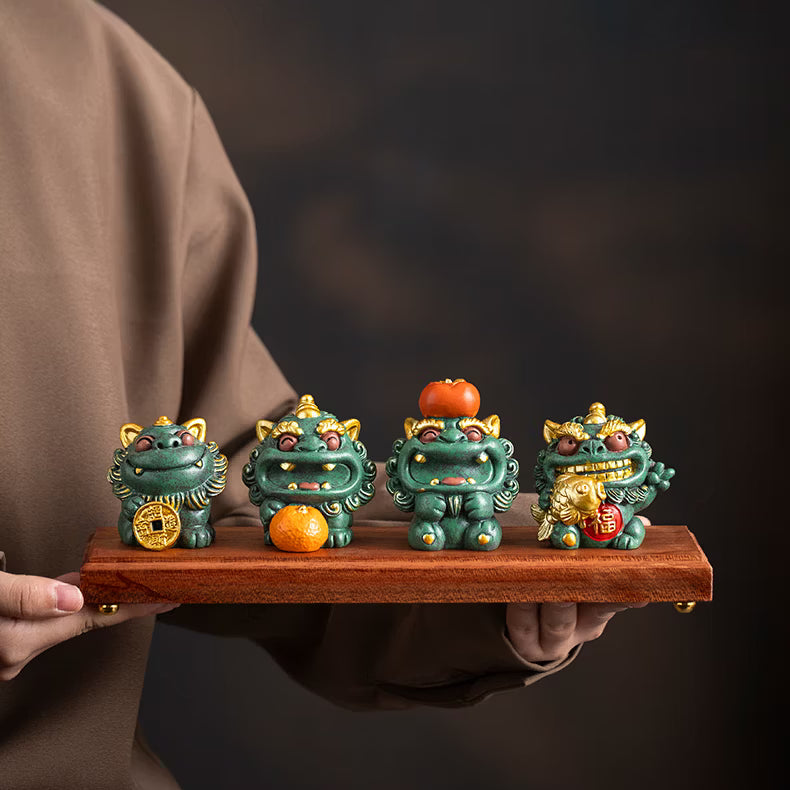 Set of cute green blue sandstone Pixiu statues with gold coin persimmon and fish accessories on wooden display