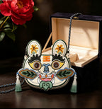 Collection of handcrafted Longxi embroidery tiger head crossbody bags in off-white and blue with long tassels