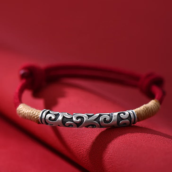Pair of S999 fine silver auspicious cloud hand-cast tube bracelets on red and black hand-woven cords