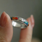 Close up of surface applied multicolor enamel fox tail details on vintage sterling silver ring band