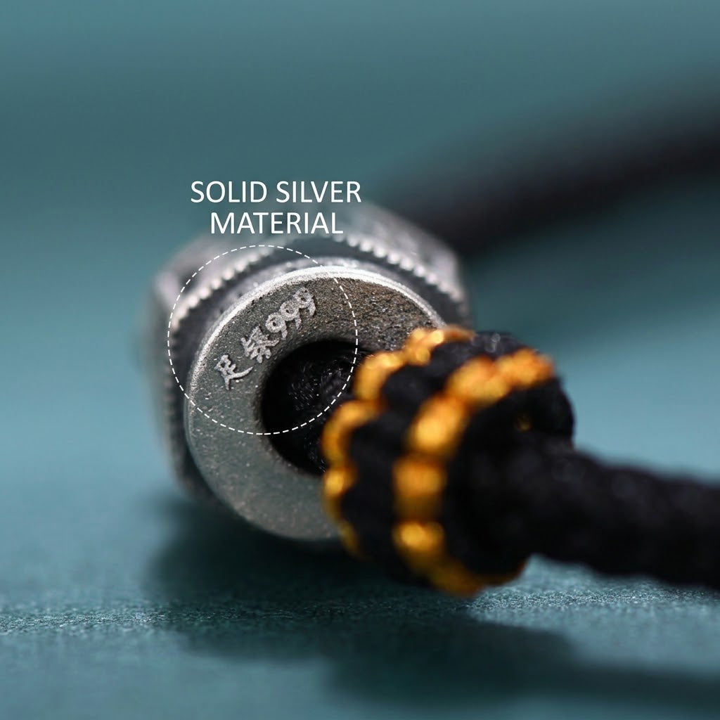 S999 fine silver Six-Syllable Mantra rotating bead on black hand-woven cord with gold accents