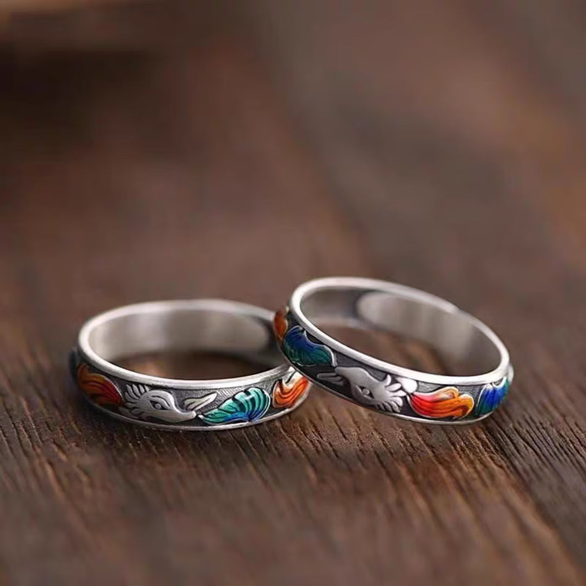 Close up of surface applied multicolor enamel fox tail details on vintage sterling silver ring band