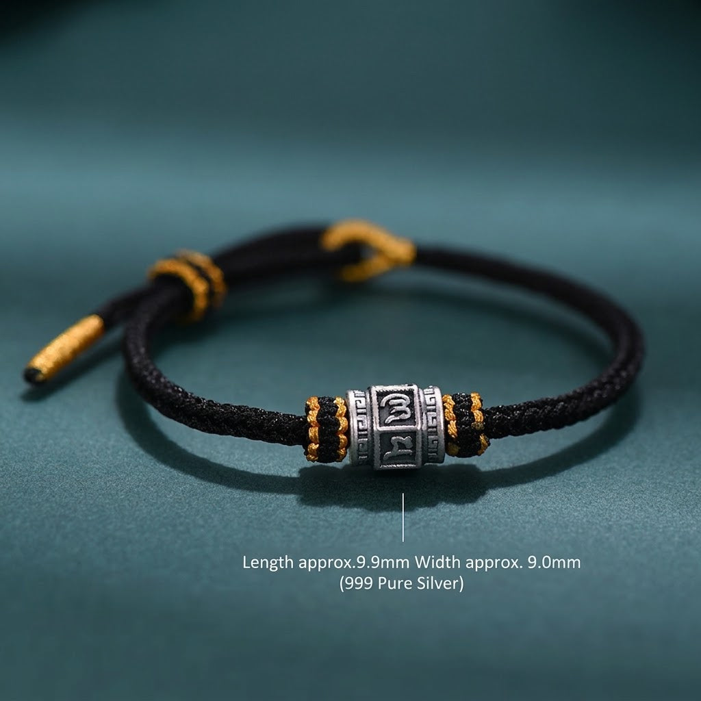 S999 fine silver Six-Syllable Mantra rotating bead on black hand-woven cord with gold accents