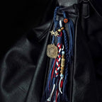 Handcrafted Tibetan braided blue and red tassel ornament with antique brass Vajra charm for bag or car hanging