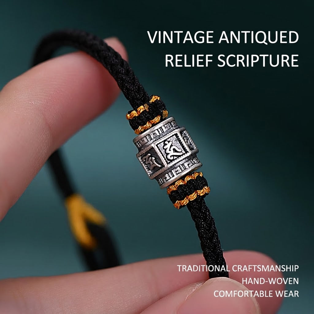 S999 fine silver Six-Syllable Mantra rotating bead on black hand-woven cord with gold accents