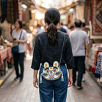 Collection of handcrafted Longxi embroidery tiger head crossbody bags in off-white and blue with long tassels