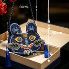 Collection of handcrafted Longxi embroidery tiger head crossbody bags in off-white and blue with long tassels