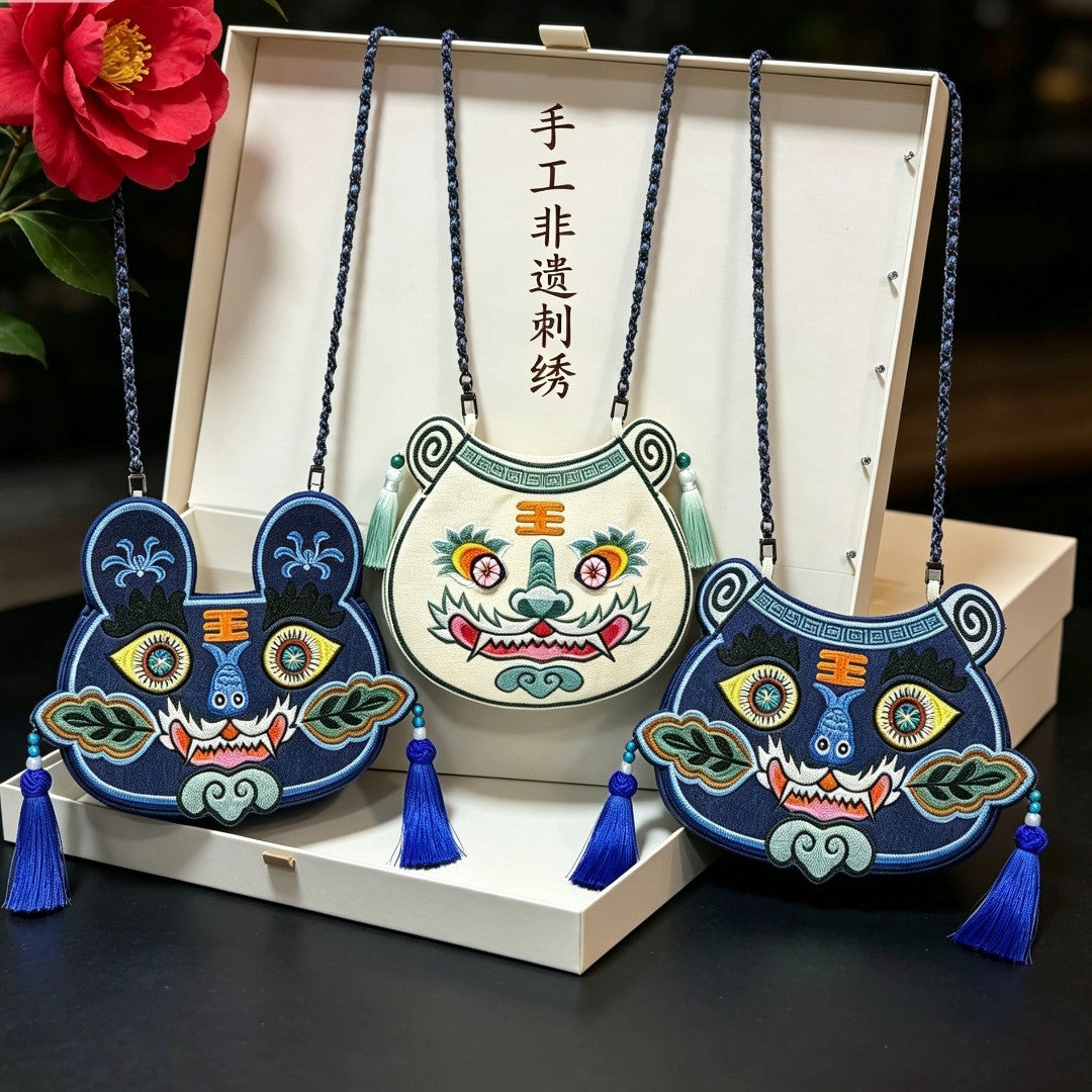 Collection of handcrafted Longxi embroidery tiger head crossbody bags in off-white and blue with long tassels