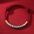 Pair of S999 fine silver auspicious cloud hand-cast tube bracelets on red and black hand-woven cords
