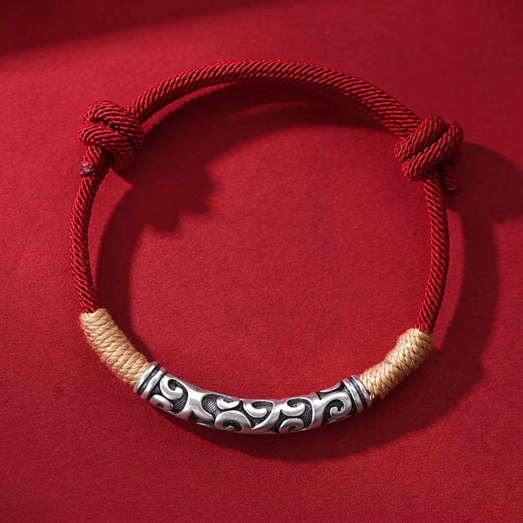 Pair of S999 fine silver auspicious cloud hand-cast tube bracelets on red and black hand-woven cords