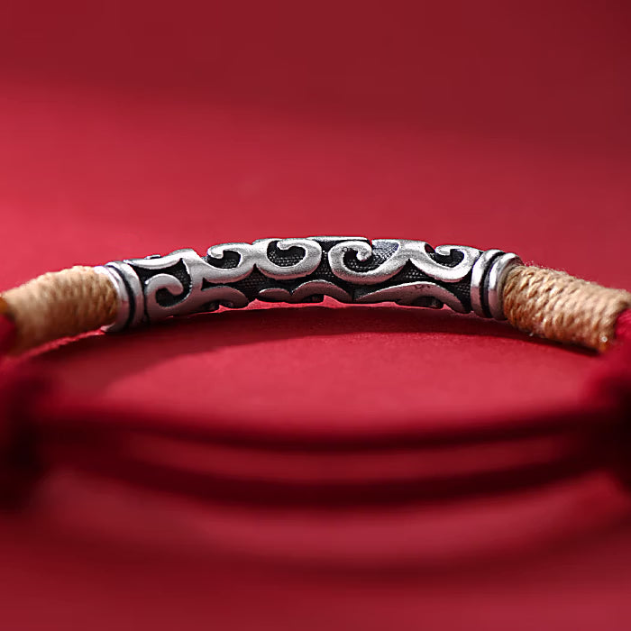 Pair of S999 fine silver auspicious cloud hand-cast tube bracelets on red and black hand-woven cords