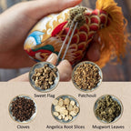 Smiling girl holding a handmade cute silk dragon carp sachet pendant with red blessing tag