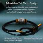 S999 fine silver Six-Syllable Mantra rotating bead on black hand-woven cord with gold accents