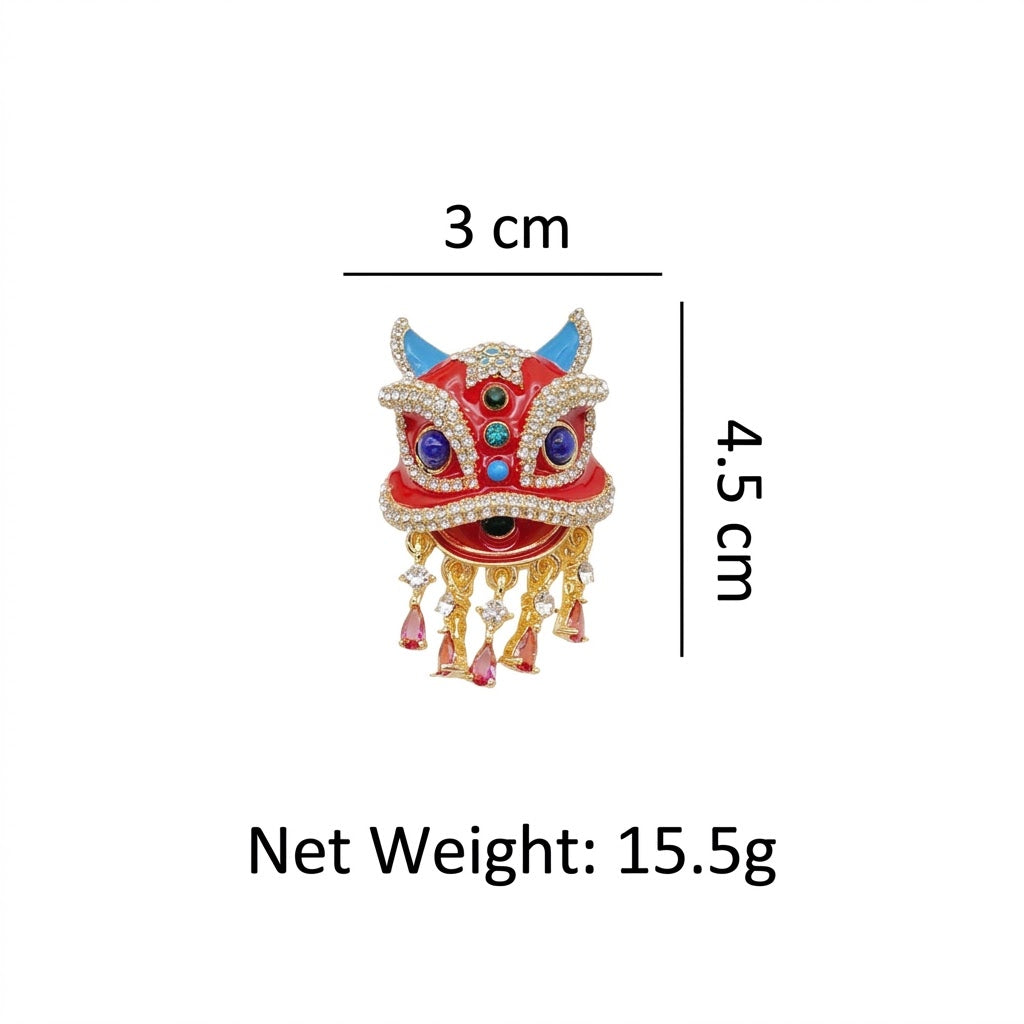 Close up of red enamel and faux rhinestone details on oriental lion dance suit lapel pin