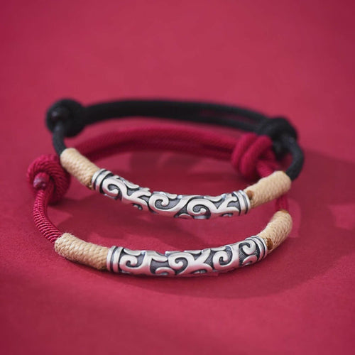 Pair of S999 fine silver auspicious cloud hand-cast tube bracelets on red and black hand-woven cords